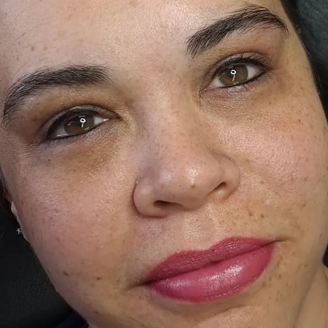 Client with permanent eyeliner and lip colour